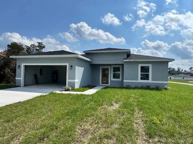 view of front of home featuring a front lawn and a garage