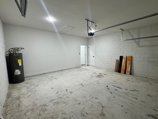 garage with a garage door opener and electric water heater