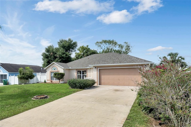 ranch-style house featuring a garage and a front yard