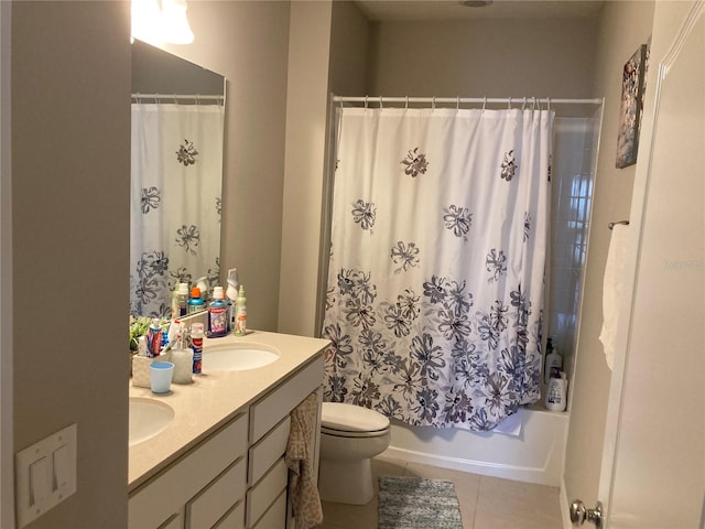 full bathroom featuring tile patterned flooring, vanity, toilet, and shower / bath combo with shower curtain