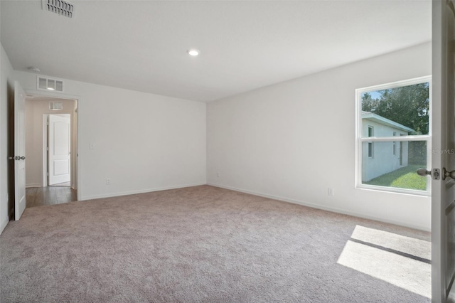 spare room featuring carpet flooring