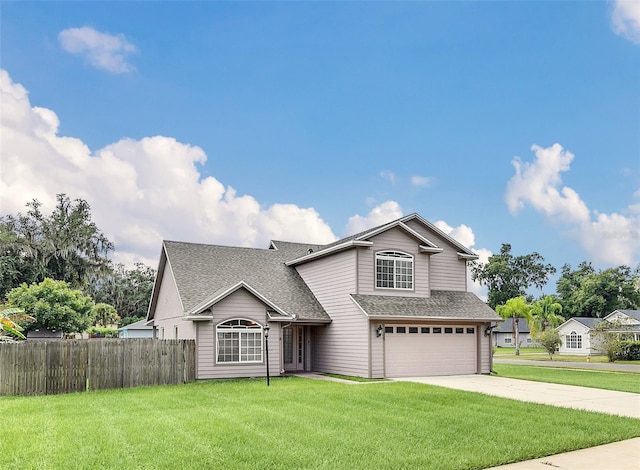 front facade featuring a garage and a front lawn