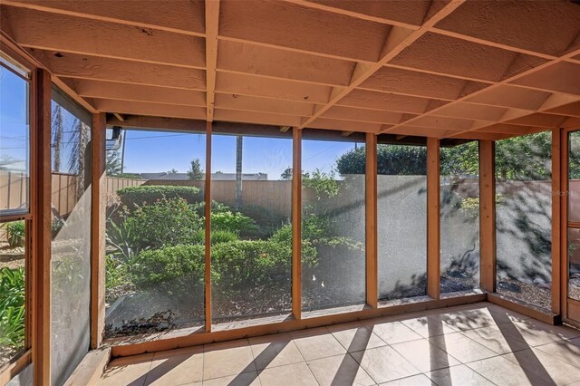 unfurnished sunroom featuring a wealth of natural light