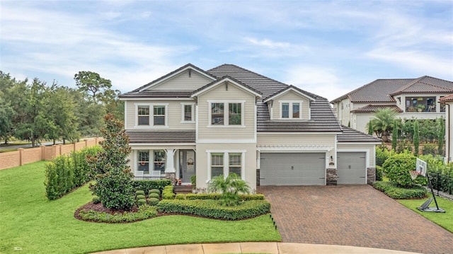 view of front facade featuring a front lawn and a garage