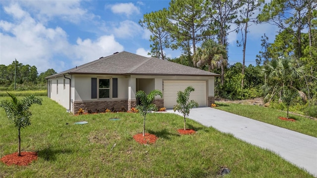 view of front facade featuring a front yard and a garage