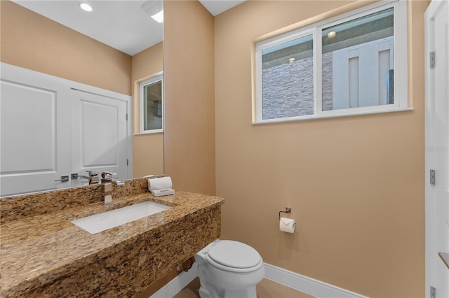 bathroom featuring toilet and sink