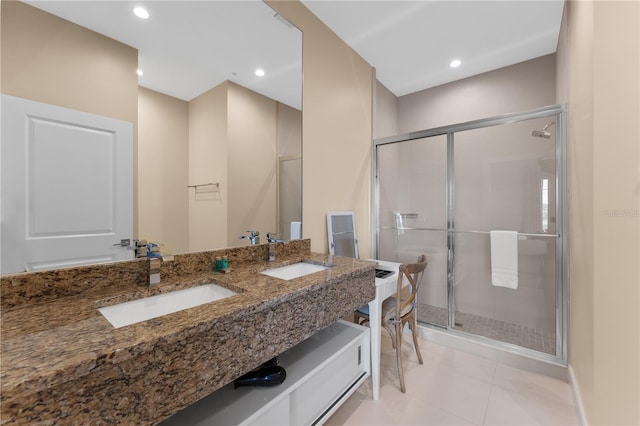 bathroom featuring vanity, an enclosed shower, and tile patterned floors