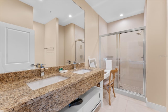 bathroom with vanity, a shower with shower door, and tile patterned floors