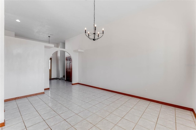 unfurnished dining area featuring light tile patterned flooring and an inviting chandelier