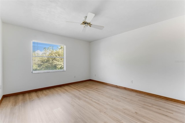 spare room featuring ceiling fan and light hardwood / wood-style flooring