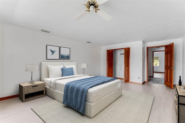 bedroom featuring a closet, ceiling fan, and wood-type flooring