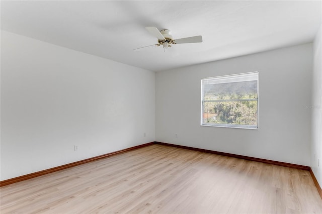 spare room with light hardwood / wood-style floors and ceiling fan