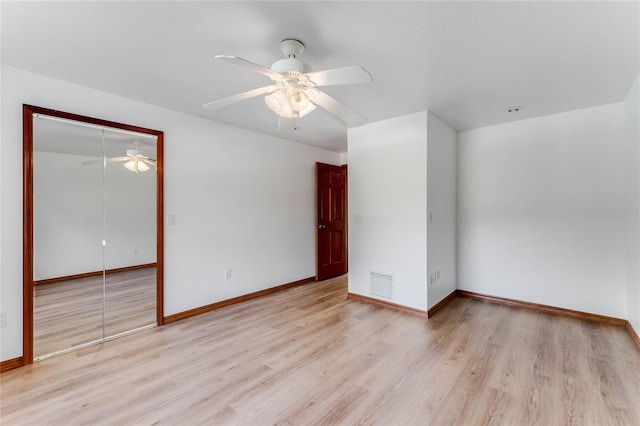 unfurnished room featuring ceiling fan and light hardwood / wood-style flooring