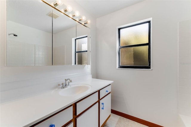 bathroom featuring vanity, a shower, and tile patterned flooring