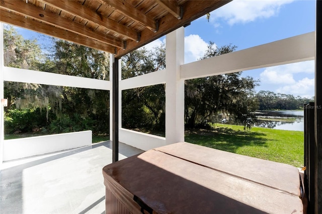 view of patio with a water view