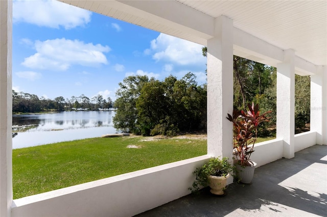 view of patio with a water view