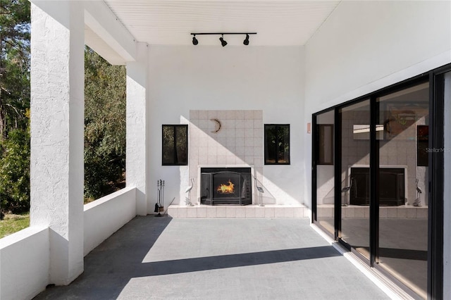 view of patio / terrace with a tile fireplace