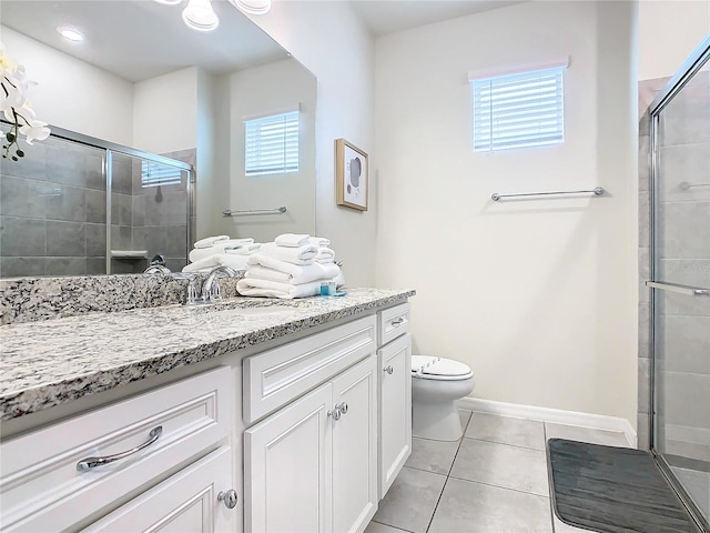 bathroom with a healthy amount of sunlight, vanity, toilet, and an enclosed shower