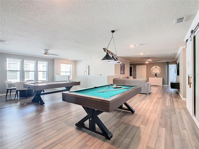 recreation room featuring ceiling fan, a textured ceiling, billiards, and light hardwood / wood-style flooring