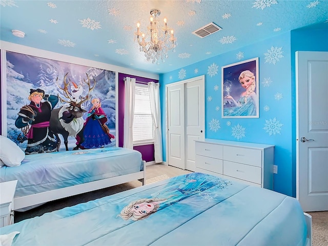 bedroom featuring a chandelier, a closet, light colored carpet, and a textured ceiling