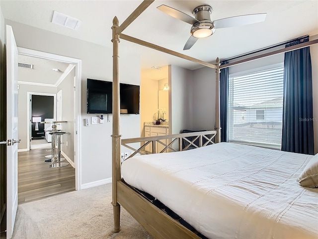 bedroom with ceiling fan, hardwood / wood-style flooring, and crown molding