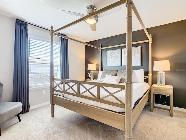 bedroom with ceiling fan and light colored carpet