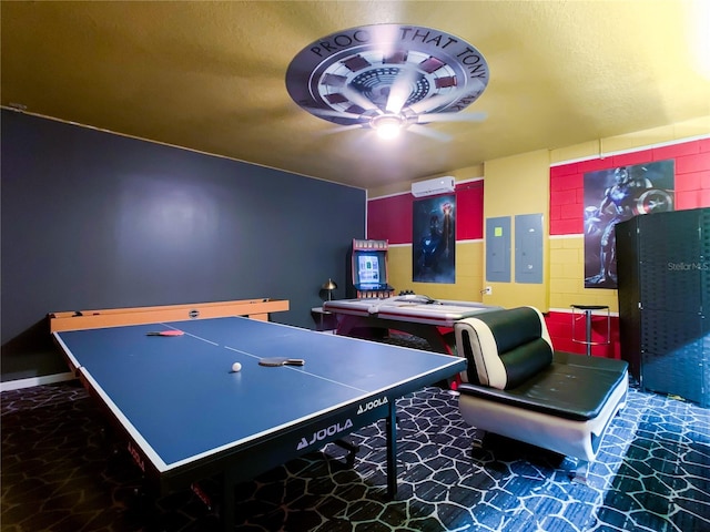 playroom with a textured ceiling, electric panel, and ceiling fan