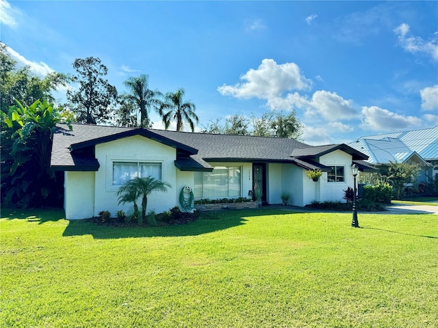 ranch-style house with a front yard