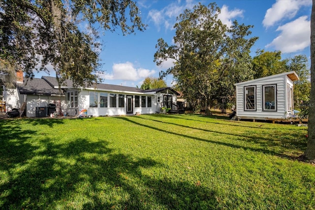 view of yard with a sunroom