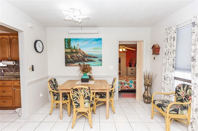 dining area with ceiling fan and light tile patterned floors