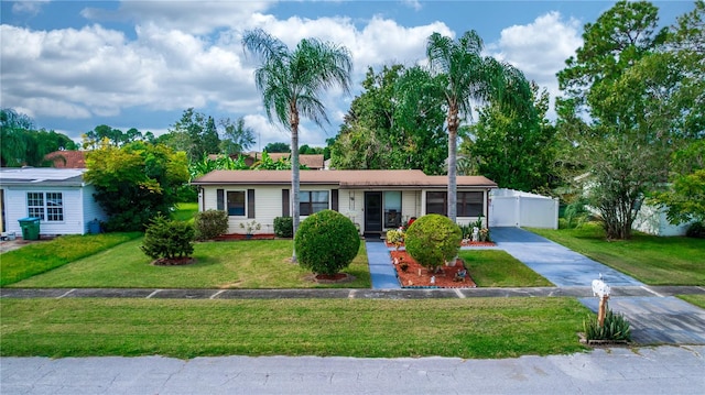 ranch-style home with a front lawn