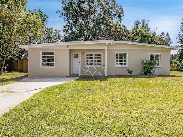 ranch-style house with a front yard