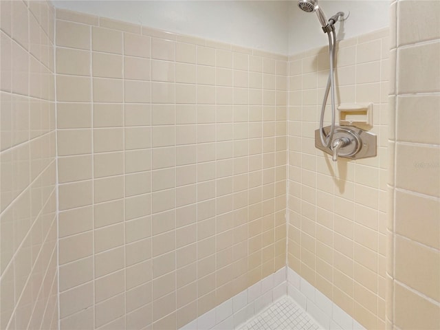 bathroom with tiled shower