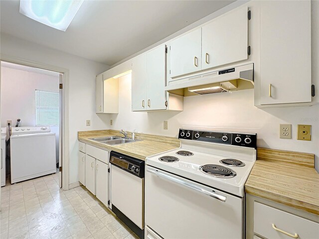 kitchen with white cabinets, white appliances, washer and clothes dryer, and sink