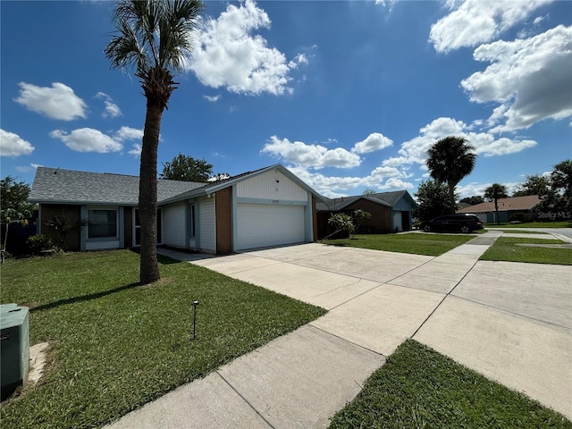 ranch-style home featuring a garage and a front lawn