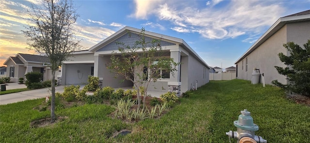 view of front of home with a lawn