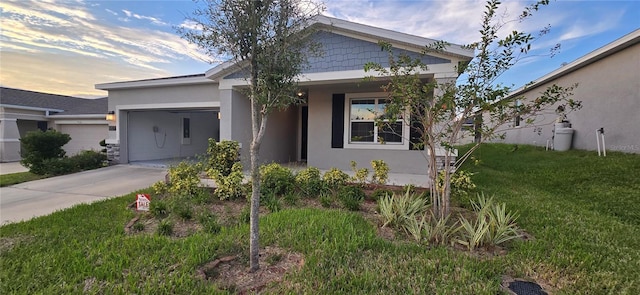 view of front of house with a lawn and a garage