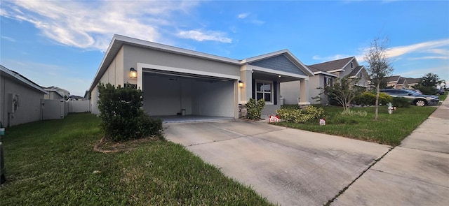 ranch-style house with a garage and a front lawn