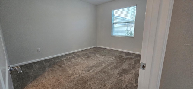 empty room with dark carpet