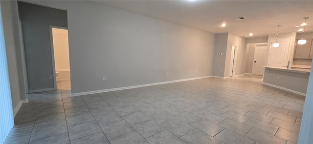 1007 Theodore St, Davenport, FL 33837 - unfurnished living room featuring baseboards, tile patterned floors, visible vents, and recessed lighting