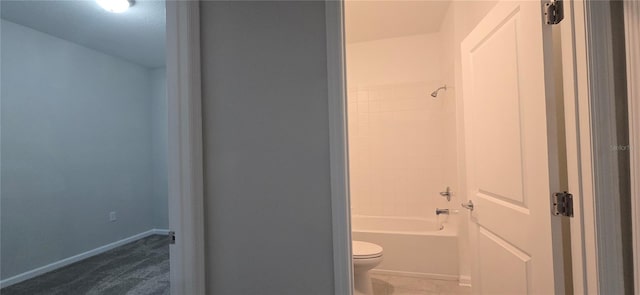 bathroom featuring toilet and shower / washtub combination