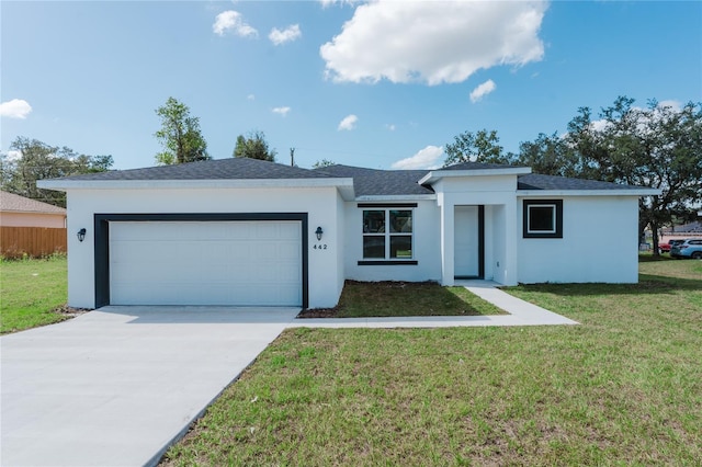 ranch-style house with a front yard and a garage