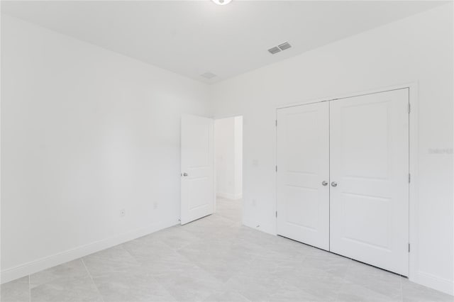 unfurnished bedroom with a closet