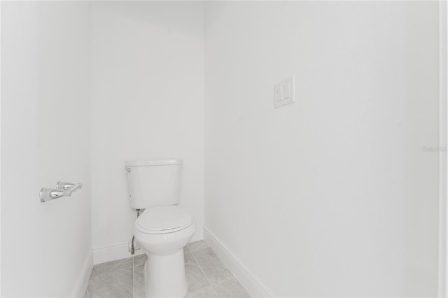 bathroom with tile patterned flooring and toilet