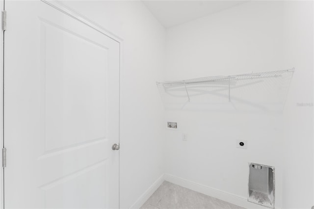 laundry area featuring hookup for a washing machine, electric dryer hookup, and light tile patterned flooring