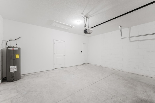 garage featuring water heater and a garage door opener