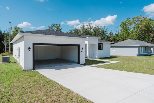 ranch-style home featuring a garage, central AC, and a front yard