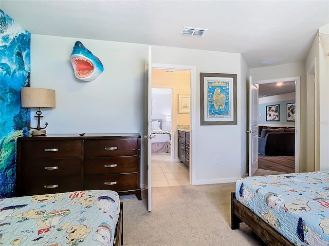 carpeted bedroom with ensuite bath