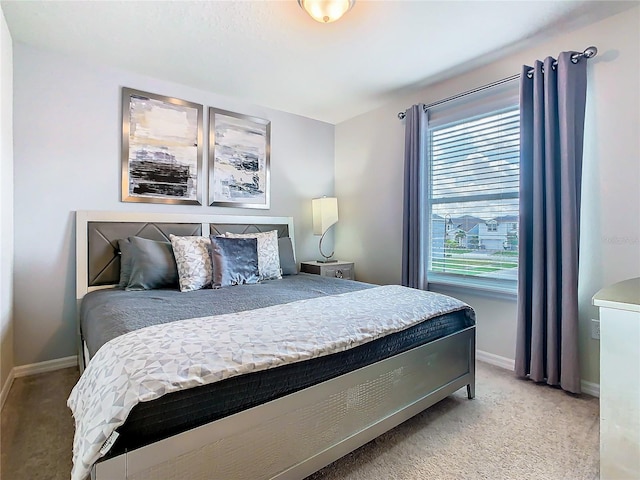 bedroom featuring light carpet