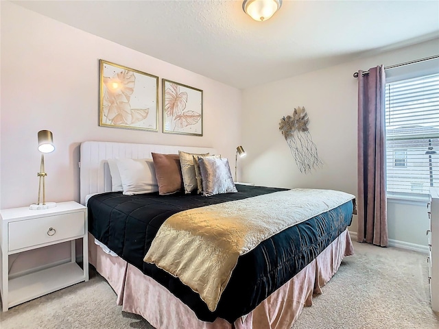 bedroom with light carpet